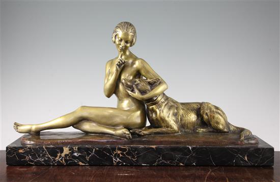 A French Art Deco bronze of a seated nude and dog, 28.5in.
